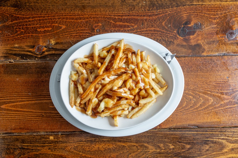 Spread of shareable pub favourites on a rustic table