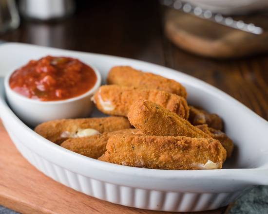 Golden mozzarella sticks beside marinara dip